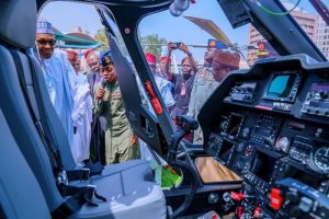 President Buhari about to enter one of the helicopters during the event.
